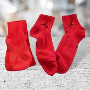 2 pairs of red athletic dri fit socks.